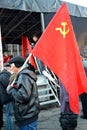 KALININGRAD, RUSSIA. Elderly man holds red USSR flag at CPRF rally