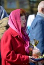 KALININGRAD, RUSSIA. The elderly woman holds ea