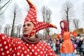 KALININGRAD, RUSSIA. The buffoon`s portrait against the background of Maslenitsa effigy in the park