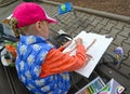 KALININGRAD, RUSSIA. The girl draws a giraffe. A children`s open-air in a zoo