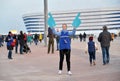 KALININGRAD, RUSSIA. The girl volunteer of the FIFA World Cup 2018 against the background of Baltic Arena stadium Royalty Free Stock Photo