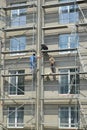 KALININGRAD, RUSSIA. Builders are engaged in finishing of a facade of a multystoried house