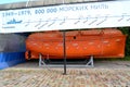 KALININGRAD, RUSSIA. Closed lifeboat in the open display of the World Ocean Museum. Russian text - nautical miles