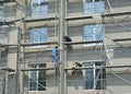 KALININGRAD, RUSSIA. Finishing of a facade of a multystoried house