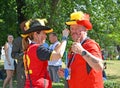 KALININGRAD, RUSSIA 2018.The Belgian football fans paint faces in colors of national flag. The FIFA World Cup in Russia