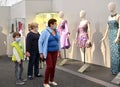 KALININGRAD, RUSSIA. Family in medical masks at an exhibition of concert costumes during the coronavirus epidemic COVID-19. Museu