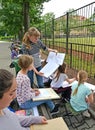 KALININGRAD, RUSSIA. The teacher teaches children to draw a giraffe. A children`s open-air in a zoo