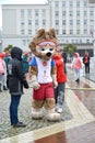 KALININGRAD, RUSSIA. A mascot of the FIFA World Cup of FIFA 2018 Zabivak`s wolf cub costs with volunteers Royalty Free Stock Photo