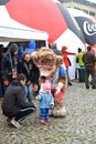 KALININGRAD, RUSSIA. A mascot of the FIFA World Cup of FIFA 2018 Zabivak`s wolf cub embraces the child