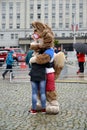 KALININGRAD, RUSSIA. A mascot of the FIFA World Cup of FIFA 2018 Zabivak`s wolf cub embraces the girl