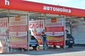 KALININGRAD, RUSSIA. Driver washes car at self-service car wash Elephant. Russian text