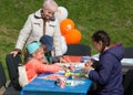 Kaliningrad, Russia - May 25, 2019: Event day `Family medical examination` Kids painting outdoor at the table