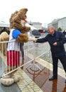 KALININGRAD, RUSSIA. The mascot of the FIFA World Cup 2018 Zabivak`s wolf greets the man Royalty Free Stock Photo