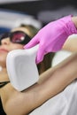 Kaliningrad, Russia - October 10, 2019: Young girl on a laser hair removal session. Laser Hair Removal Cabinet
