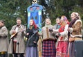 KALININGRAD, RUSSIA. Performers of amateur ensemble speak in the park at the celebration of Maslenitsa