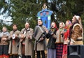 KALININGRAD, RUSSIA. Performers of folklore ensemble speak in the park at the celebration of Maslenitsa