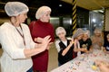 A joint lesson for children and parents in sculpting figures from a pastry mastic. Children`s workshop at the chocolate factory