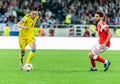 Kazakhstan national football team defender Aibol Abiken against Russia midfielder Magomed Ozdoyev