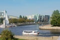 Kaliningrad, Russia - September 2020: Pleasure boat with tourists on Pregolya river. Embankment with monument to fishermen and Royalty Free Stock Photo