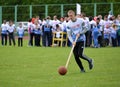 KALININGRAD, RUSSIA. The young man rolls before himself a ball by means of a stick at the competitions Cheerful Starts