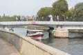 Kalininrad, Russia - September 2020: Pedestrian drawbridge on Kant Island. Wedding and tourist boat on river. City landscape