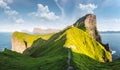 Kallur lighthouse on green hills of Kalsoy island Royalty Free Stock Photo