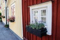 Cozy hugge atmospheric Scandinavian wooden multi-colored houses with a facade door. Fairy houses of Scandinavia
