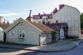 Cozy hugge atmospheric Scandinavian wooden multi-colored houses with a facade door. Fairy houses of Scandinavia