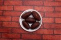 Kalojam or gulab jamun sweet served in plate isolated on background top view of bangladeshi dessert food