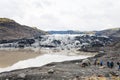 Tourists on hiking path to Solheimajokull glacier
