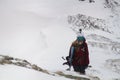 Kaltenbach Ã¢â¬â¹Hochfugen, Austria - 11 Jan, 2020: Snowboarder female climbs mountains with camera and abs backpack