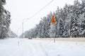 Kaluga, Russia - February 2018: winter landscape, road with lonely car through fairy pine forest covered by fresh white snow.