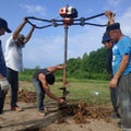 Kaluga, Russia June 11, 2019: manual drilling with the installation of drilling pneumatic shock STIHL
