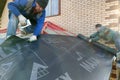 Kaluga, Russia November 11, 2019: construction work, work with waterproofing material, waterproofing film for the roof