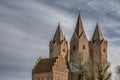 Kalundborg churh with five towers against a grey sky