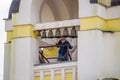 Kaluzhskiy region, Russia - July 2019: Woman-ringer is ringing the bells on the bell tower of a Russian Orthodox church Royalty Free Stock Photo