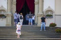 Praying people on the steps of the church during the holy mass, Kalwaria Zebrzydowska, Poland