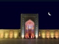 Kalyan mosque with multicolored lighting in Bukhara on a moonlit night