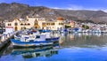 Traditional colorful houses,boats,sea and mountains,Kalymnos island,Dodecanese,Greece. Royalty Free Stock Photo