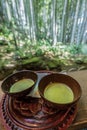 Two bowls of Maccha green tea in the Kyukoan teahouse with Hokoku-ji Grove of moso bamboo zen