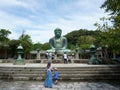 Tourists around a big bronze buddha statue known as Great Buddha of Kamakura Royalty Free Stock Photo