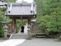 Japanese shrine entrance with shinto monk with traditional costume.-