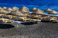 Kamari beach of Santorini covered with black pebbles, Greece Island Royalty Free Stock Photo