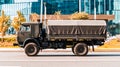 KamAZ 4350 is a rough terrain truck designed for military applications. Tented truck is driving on the city street. Army vehicle