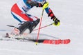 Cropped close-up view of skier sports person skiing down an alpine mountain ski slope