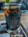 Kamen-na-Obi, Altai, Russia - May 28, 2020: Russian tea on the train, a glass in a brass stand, black tea is drunk on trains of