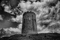 Kamenets tower in black and white style with cloudy sky on background
