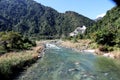 Kameng river flowing through forested valley of Himalaya near Bomdila, Arunachal Pradesh, India.Sunny morning with blue sky.River