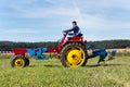 Plowing vintage veteran tractors on field on ploughing championship Royalty Free Stock Photo