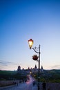 Kamianets-Podilskyi is a romantic city, a beautiful view of the evening city, lanterns illuminate the bridge, lantern